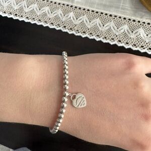 Silver Tiffany and co bracelet with Tiffany blue heart.